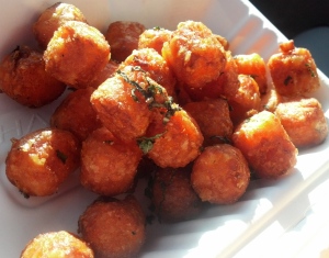 Sweet potato tater tots, tossed with mint, sea salt, and fresh pepper.  Crispy on the outside and light and delicate on the inside.  I love these so much.