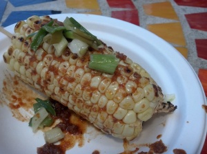 Fresh grilled corn with spicy garlic sauce.