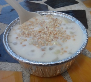 Tapioca and corn with coconut sauce, topped with sesame seeds.